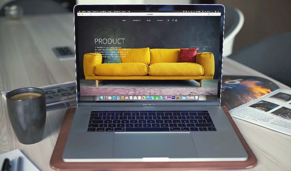 A laptop displaying the product page for a sofa on an eCommerce website.