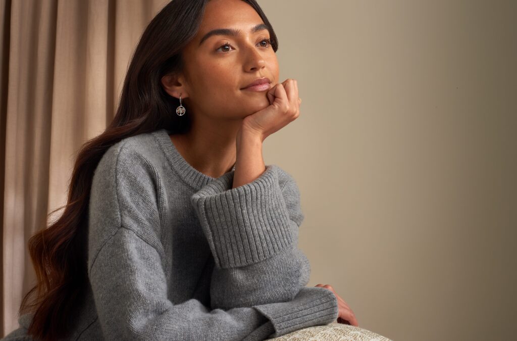 A model wearing Clogau earrings.