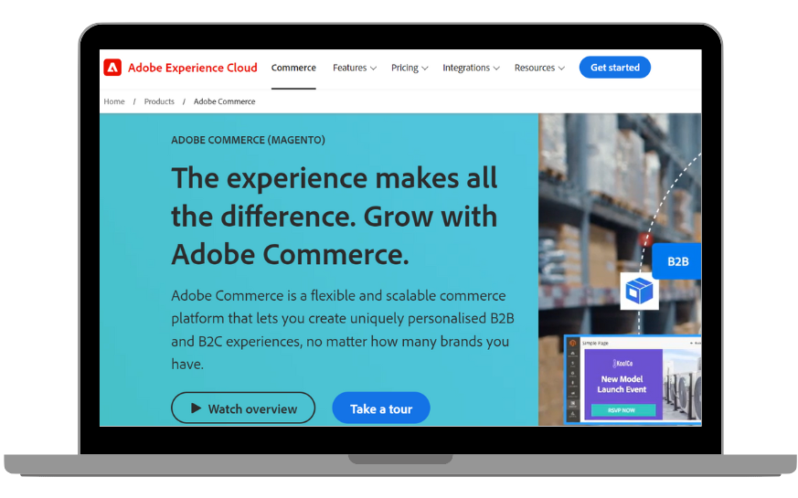 A laptop displaying the Magento/Adobe Commerce homepage.
